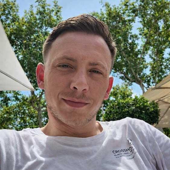 Selfie of Clynton Hagen, a 32-year-old man with short hair and light stubble, looking directly at the camera. This is the man who killed Ollie by shaking him.