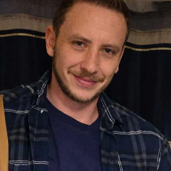 Another selfie of Clynton Hagen indoors, wearing a plaid shirt. He appears relaxed, in stark contrast to the severity of the crime he committed.