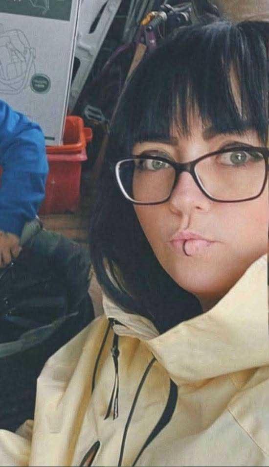 A woman with dark brown hair, identified as Kirsty Ann Edwards, looking towards the camera with a neutral expression.